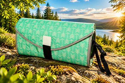 Compact baby changing pad folded for diaper bag storage